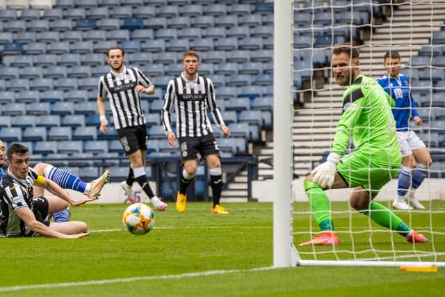 Chris Kane slides St Johnstone's opener past Jak Alnwick. (Photo by Alan Harvey / SNS Group)