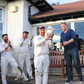 Bryan Clarke gets his hands on the Premier Division trophy in 2019 (Pic by David Potter)