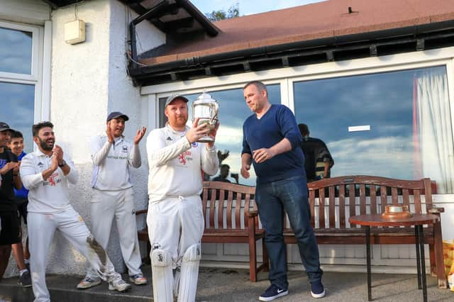 Bryan Clarke gets his hands on the Premier Division trophy in 2019 (Pic by David Potter)