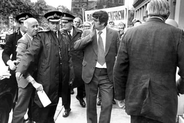Police stop SNP candidate Ian White from presenting a letter to Prime Minister James Callaghan on his visit to Glasgow in September 1977.