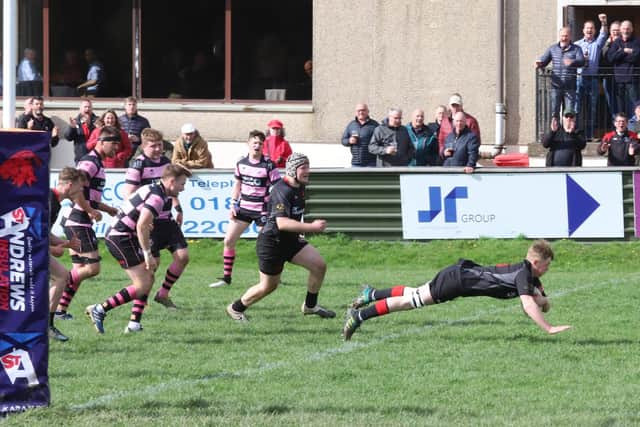 Thomas Young scores his first try for the Biggar senior XV on his debut (Pic by Nigel Pacey)