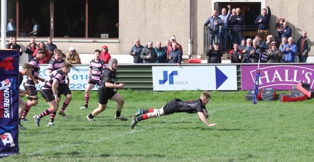 Thomas Young scores his first try for the Biggar senior XV on his debut (Pic by Nigel Pacey)