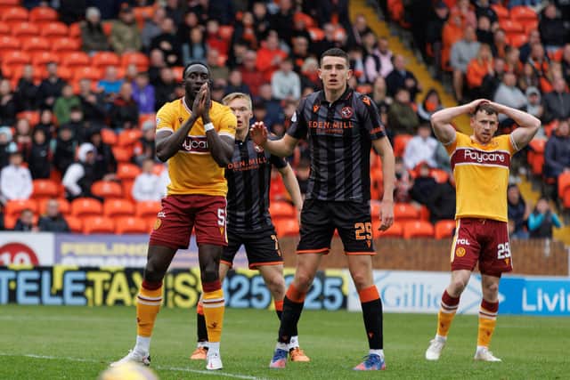 Bevis Mugabe and Connor Shields watch another chance go begging for Motherwell (Pic by Ian McFadyen)