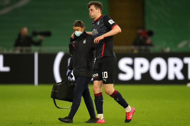 Anton Dowds of Falkirk is helped off the pitch after picking up an injury during his team's Scottish Cup third-round match against Celtic today in Glasgow (Photo by Ian MacNicol/Getty Images)