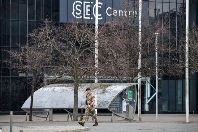 A member of the armed forces walks from the SECC which was turned into the NHS Louisa Jordan hospital.