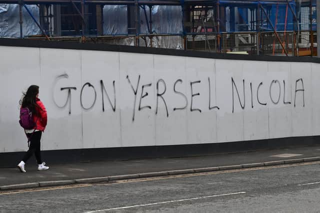 Graffiti in support of First Minister Nicola Sturgeon has been spray painted onto a wall of a building site in Glasgow's West End. Picture: John Devlin
