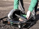 Loading up the Holland's pies on the drone for delivery (photo: Ben Frith)