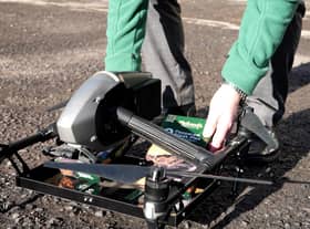 Loading up the Holland's pies on the drone for delivery (photo: Ben Frith)