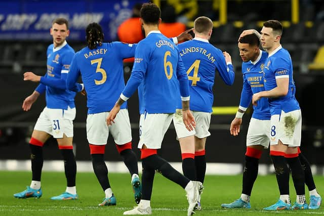 The Rangers players celebrate after captain James Tavernier had opened the scoring in their 4-2 win over Borussia Dortmund in the first leg of their Europa League knockout round play-off tie in Germany last week. (Photo by Martin Rose/Getty Images)