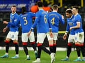 The Rangers players celebrate after captain James Tavernier had opened the scoring in their 4-2 win over Borussia Dortmund in the first leg of their Europa League knockout round play-off tie in Germany last week. (Photo by Martin Rose/Getty Images)