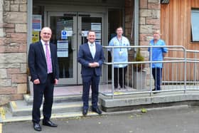 Joint East Dunbartonshire Council leaders Vaughan Moody and Andrew Polson with some of the clinical team at the War Memorial Hall