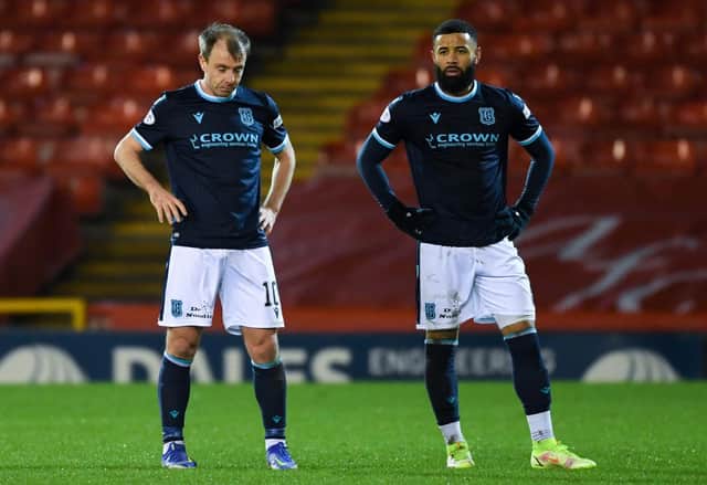 Dundee's Paul McGowan (left) and Alex Jakubiak look dejected during a Cinch Premiership match between Aberdeen and Dundee at Pittodrie Stadium, on December 26, 2021, in Aberdeen, Scotland. (Photo by Ross MacDonald / SNS Group)