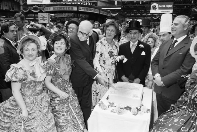 British Rail staff dress in Victorian costume with a cake to celebrate the 100th birthday of Glasgow Central station in August 1979.