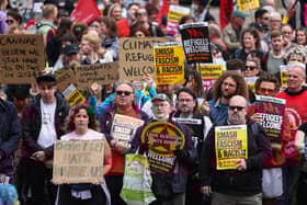 Protesters hold banners during a "Stop the Far Right" demonstration at George Square in Glasgow, Scotland.