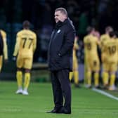 Celtic manager Ange Postecoglou is left dejected as Bodo/Glimt players celebrate their first leg win at Celtic Park. (Photo by Craig Williamson / SNS Group)