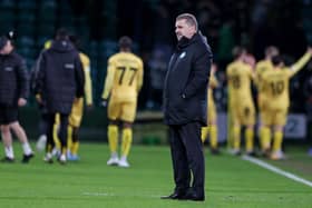 Celtic manager Ange Postecoglou is left dejected as Bodo/Glimt players celebrate their first leg win at Celtic Park. (Photo by Craig Williamson / SNS Group)