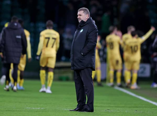 Celtic manager Ange Postecoglou is left dejected as Bodo/Glimt players celebrate their first leg win at Celtic Park. (Photo by Craig Williamson / SNS Group)