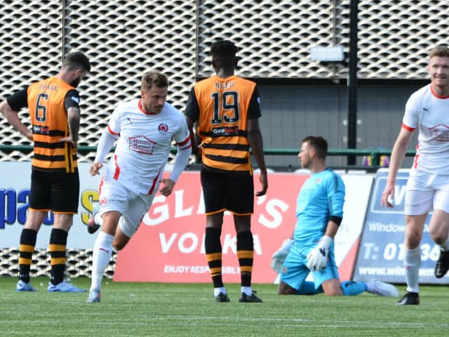 David Goodwillie runs off in celebration after grabbing the winner for Clyde against Alloa (pic: David Glencross)