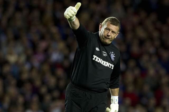 <p>Rangers goalkeeper Andy Goram salutes the fans during a Legends friendy match against AC Milan at Ibrox in 2012.</p>