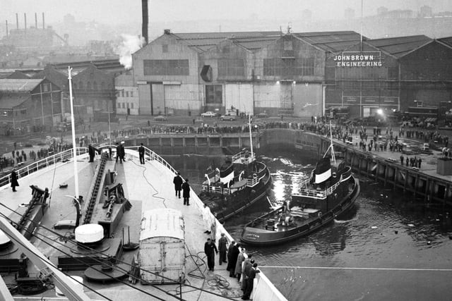 The view from the bridge as tugs guide the Queen Elizabeth II liner into John Brown's shipyard on the Clyde in November 1968
