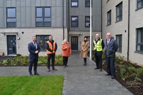 Tenant Catherine Cole is welcomed to her new home at the former Tom Johnston House