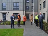 Tenant Catherine Cole is welcomed to her new home at the former Tom Johnston House
