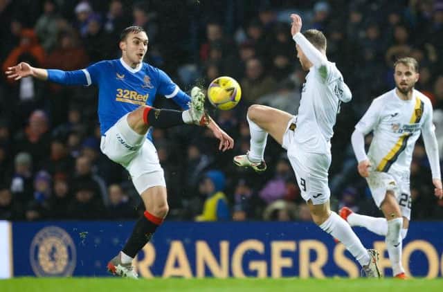 Rangers midfielder James Sands (left) challenges Livingston striker Bruce Anderson during Wednesday's Premiership match at Ibrox. (Photo by Alan Harvey / SNS Group)