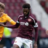 Beni Baningime battles Motherwell's Mark O'Hara for the ball during Hearts' 2-0 victory at Tynecastle. Picture: SNS