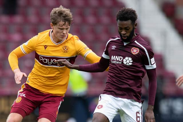 Beni Baningime battles Motherwell's Mark O'Hara for the ball during Hearts' 2-0 victory at Tynecastle. Picture: SNS