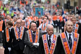 Members of the Orange Order and their supporters march through the city on September 18, 2021 in Glasgow, Scotland. Around 13,000 marchers are expected to take part in more than 50 parades through the city centre heading to Glasgow Green to celebrate the 200th anniversary of the first Battle of the Boyne parade in Glasgow. (Photo by Jeff J Mitchell/Getty Images)