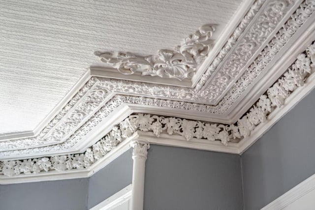 Original features including cornicing and bold timber mouldings have been retained.