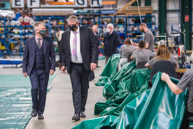 Minister for business, trade, tourism and enterprise Ivan McKee is given a tour of the factories 74,000 ft2 manufacturing space by David Beal MD of the Beal group. The group has had a 4 million pound injection of funding in part from Scottish Enterprise.

