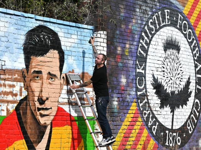 Artist, Bobby McNamara AKA Rogue Oner works on the Jags' mural. Picture: John Devlin.