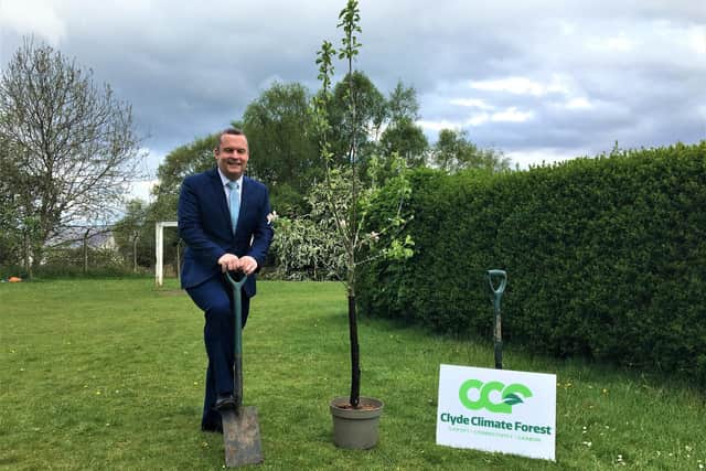Councillor Andrew Polson, joint leader of East Dunbartonshire Council, is ready to start planting