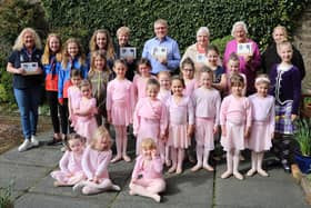 Young stars who took part in the 50th anniversary show recently met the benefactors to present the proceeds.