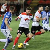 David Goodwillie tries to find a way through the Kilmarnock defence (pic: Craig Black Photography)