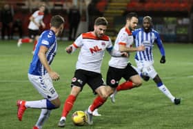 David Goodwillie tries to find a way through the Kilmarnock defence (pic: Craig Black Photography)