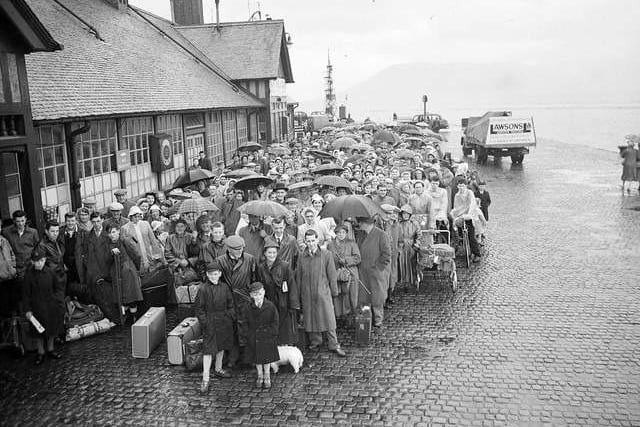Queuing in the rain for the ferry at Gourock during the Glasgow Fair holiday in 1956.