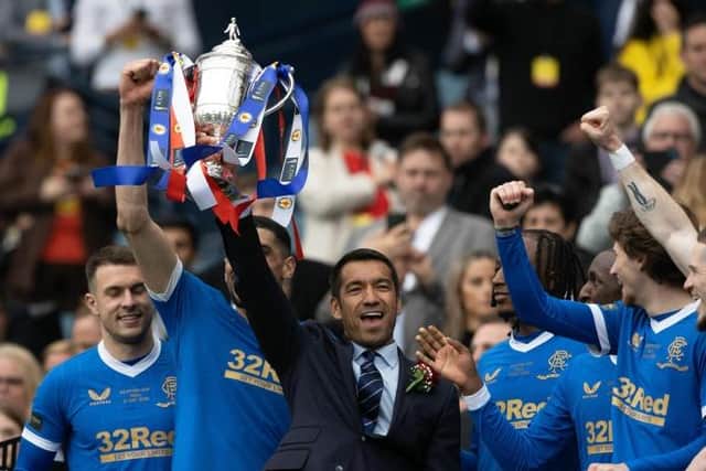 Giovanni van Bronckhorst celebrates his first trophy as Rangers manager as he holds the Scottish Cup aloft at Hampden. (Photo by Craig Williamson / SNS Group)