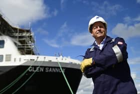 David Tydeman beside Glen Sannox at the Ferguson Marine yard. (Photo by John Devlin/The Scotsman)