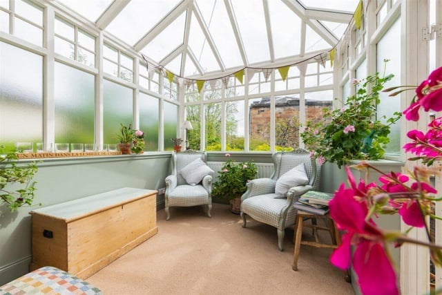 The conservatory looks out over the garden.