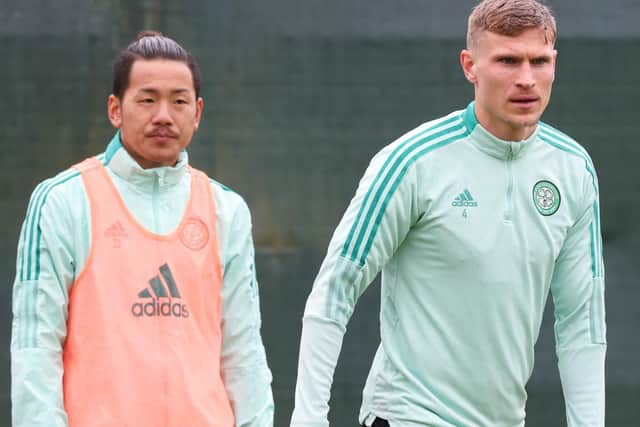 Yosuke Ideguchi (left) and Carl Starfelt are both ruled of Celtic's Premiership opener against Aberdeen.  (Photo by Craig Williamson / SNS Group)