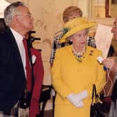 Jim Arnold presented the Queen with a Silent Monitor, the tool mill managers used in Robert Owen's time to monitor the behaviour and productivity of the millworkers.