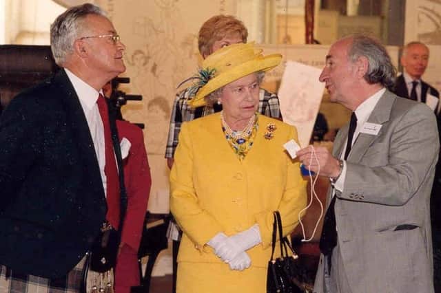 Jim Arnold presented the Queen with a Silent Monitor, the tool mill managers used in Robert Owen's time to monitor the behaviour and productivity of the millworkers.