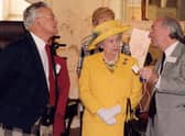 Jim Arnold presented the Queen with a Silent Monitor, the tool mill managers used in Robert Owen's time to monitor the behaviour and productivity of the millworkers.