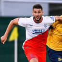 Christian Burgess marked his Champions League debut with a win over Rangers on Tuesday.