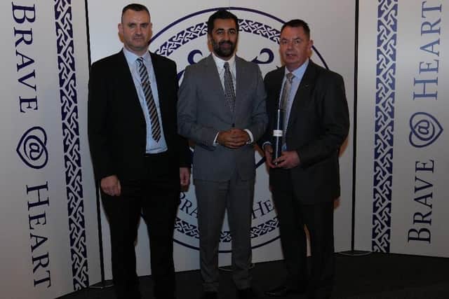 Paul Taylor (left) and David Taylor were on hand to receive their dad's Brave@Heart award from First Minister Humza Yousaf.