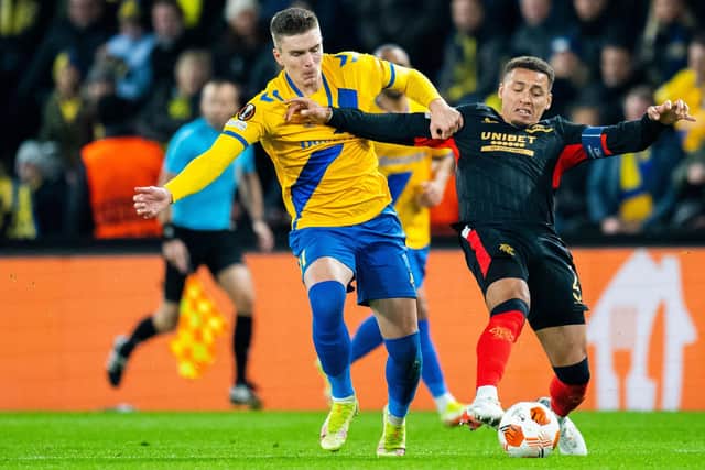 Rangers captain James Tavernier (right) closes down Brondby striker Mikael Uhre during the Europa League match in Denmark. (Photo by MARTIN SYLVEST/Ritzau Scanpix/AFP via Getty Images)