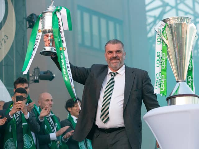 Ange Postecoglou holds aloft the Scottish Cup in front of gathered fans at Celtic Park after completing the domestic treble. (Photo by Ewan Bootman / SNS Gro