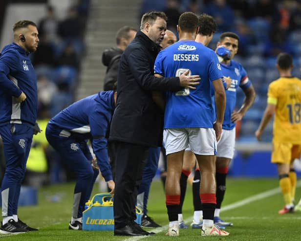 Rangers manager Michael Beale speaks to Cyriel Dessers during a Viaplay Cup Quarter-final match between Rangers and Livingston at Ibrox